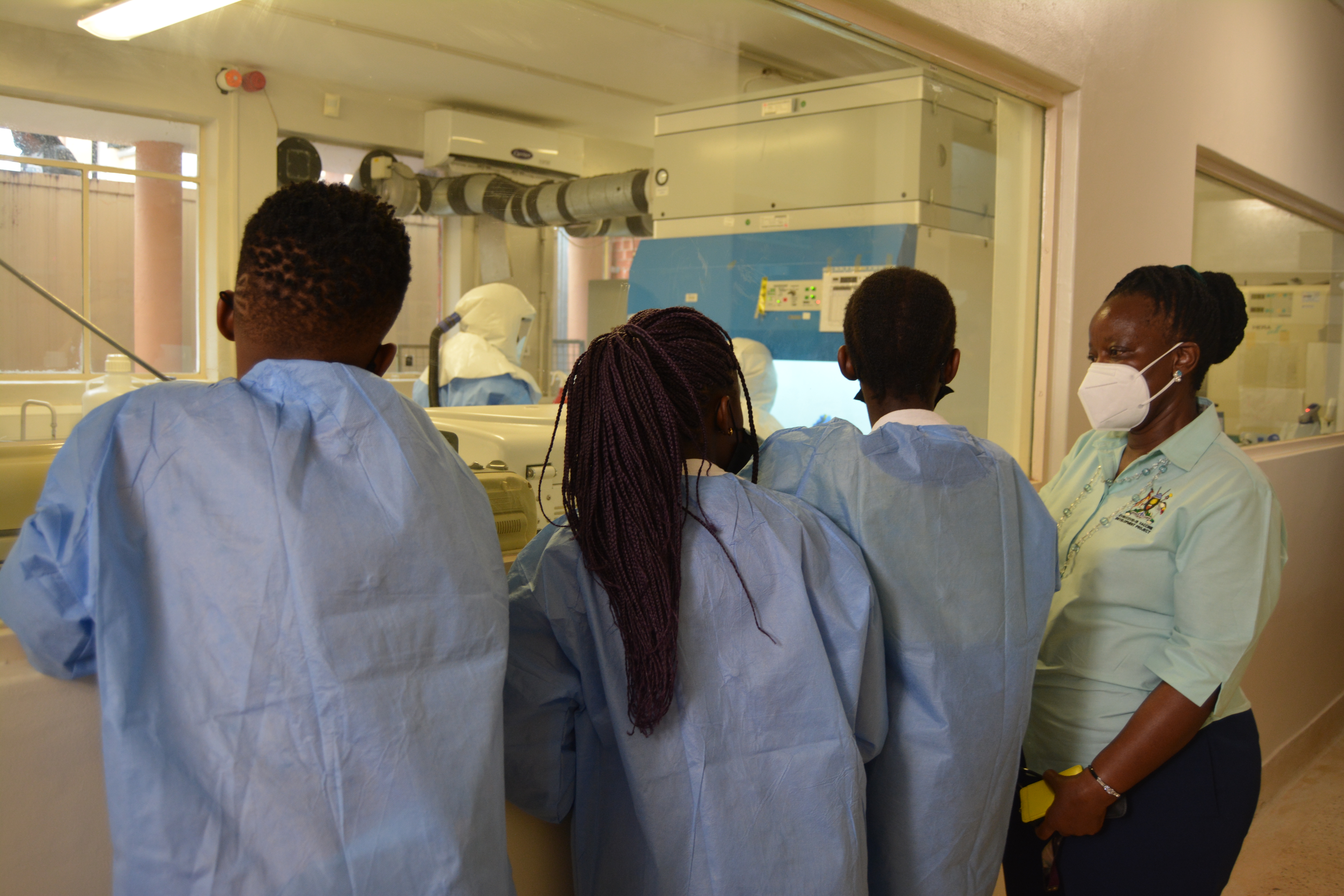 Dr Jennifer takes the children on a science tour of the Covid Vaccine Research Project