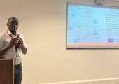 Dr Egesa presenting WORMVACS2.0 during the special seminar at the Biosciences Department at the KEMRI Wellcome Trust Research Programme.