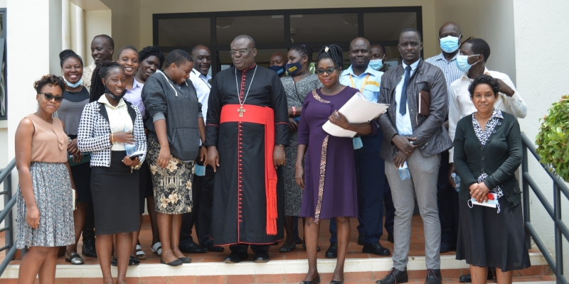 The Archdeacon with some of the staff at UVRI