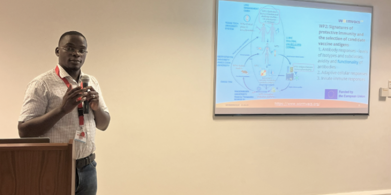 Dr Egesa presenting WORMVACS2.0 during the special seminar at the Biosciences Department at the KEMRI Wellcome Trust Research Programme.